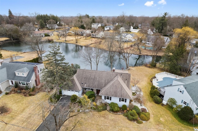 bird's eye view with a residential view and a water view