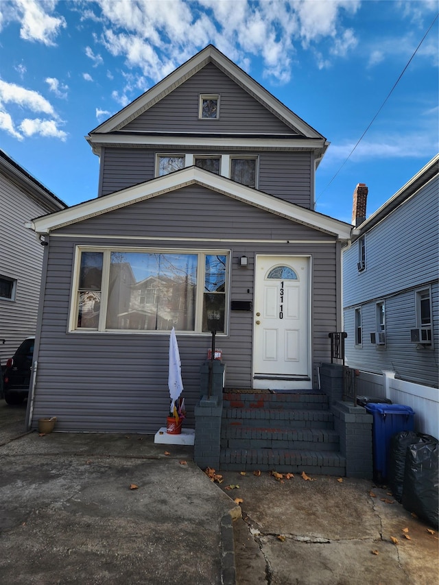 view of front of house with entry steps and cooling unit