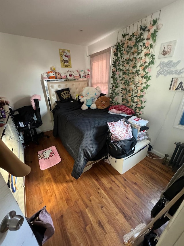 bedroom with wood finished floors