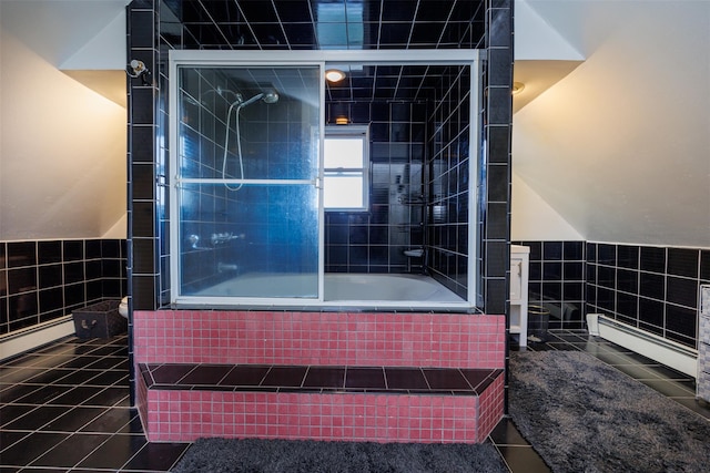 full bath featuring tiled shower / bath combo, tile walls, and tile patterned floors