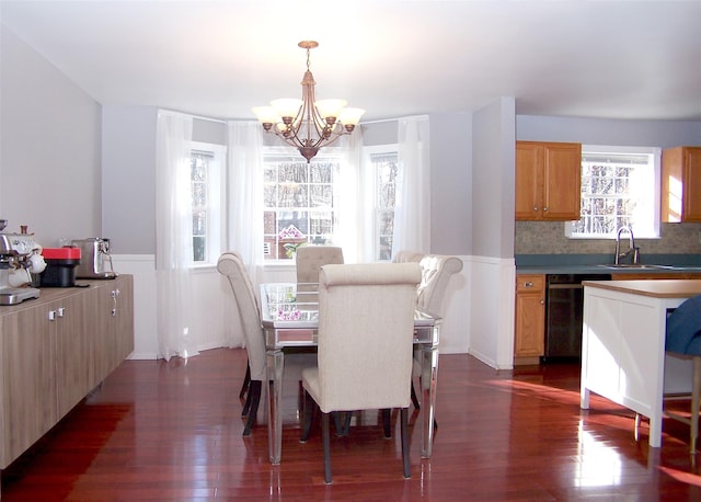 dining room featuring a chandelier and dark wood finished floors