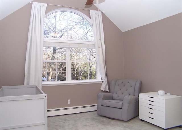 living area with lofted ceiling, a baseboard radiator, a ceiling fan, and light colored carpet