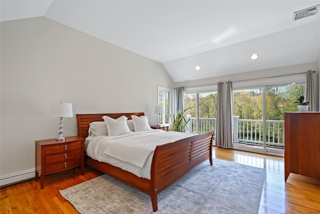 bedroom with visible vents, wood finished floors, access to outside, a baseboard radiator, and vaulted ceiling