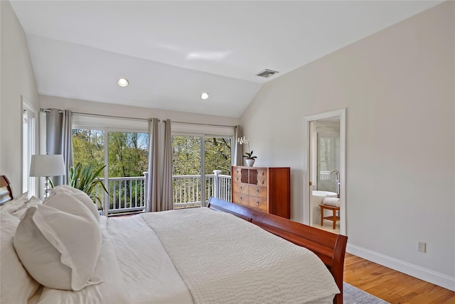 bedroom featuring access to exterior, baseboards, wood finished floors, lofted ceiling, and visible vents