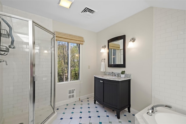 full bath featuring vanity, a stall shower, a tub to relax in, and visible vents