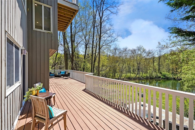 wooden deck with a water view
