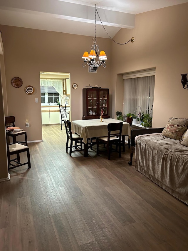 dining room with baseboards, wood finished floors, beam ceiling, high vaulted ceiling, and a notable chandelier