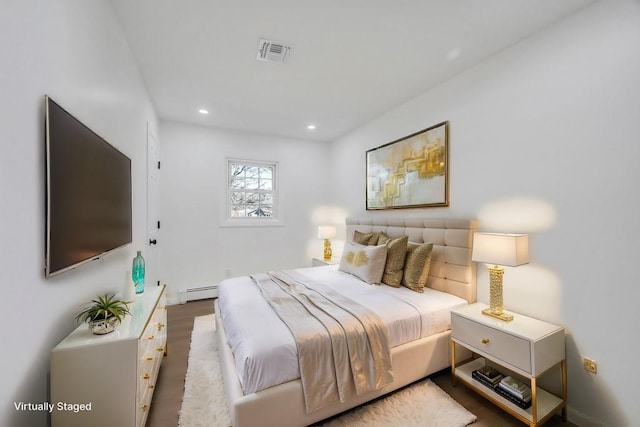 bedroom featuring recessed lighting, visible vents, and baseboard heating