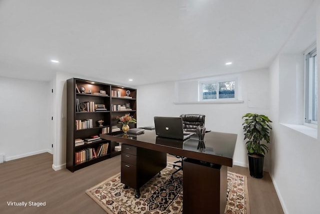 home office featuring light wood-type flooring, baseboards, and recessed lighting