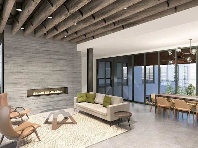 interior space with finished concrete floors, a glass covered fireplace, a chandelier, and wood walls