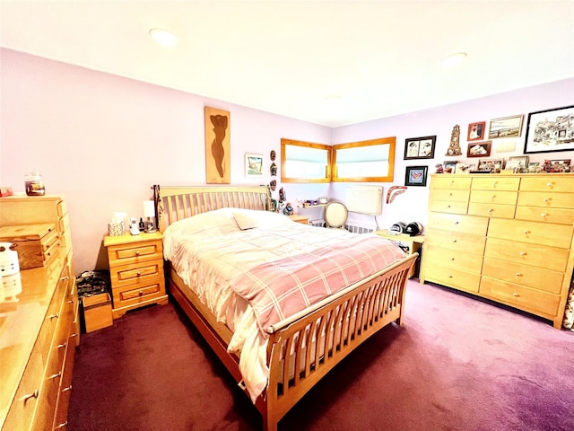 bedroom featuring dark carpet