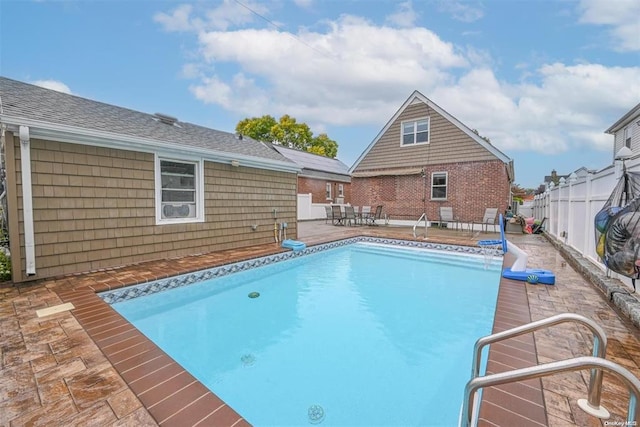 view of pool featuring a patio area, fence, and a fenced in pool