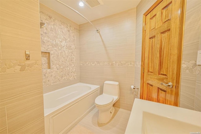 bathroom featuring toilet, shower / tub combination, tile walls, and tile patterned floors