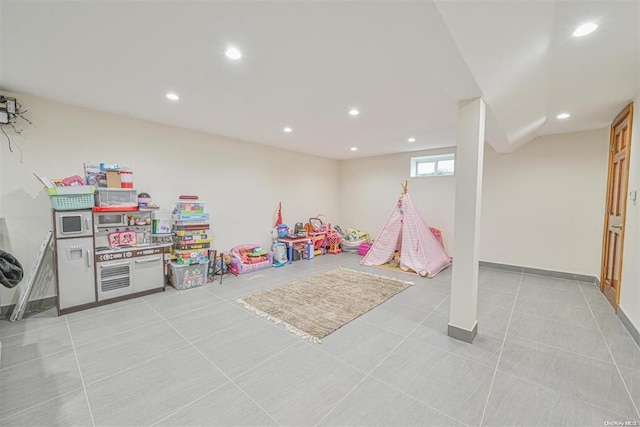 rec room featuring recessed lighting, baseboards, and light tile patterned floors