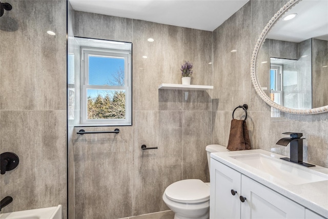 full bath featuring tile walls, toilet, and vanity