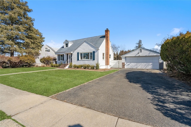 cape cod house with an outbuilding, a chimney, a gate, a garage, and a front lawn