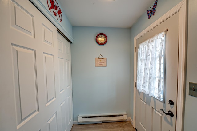 doorway with baseboards and baseboard heating