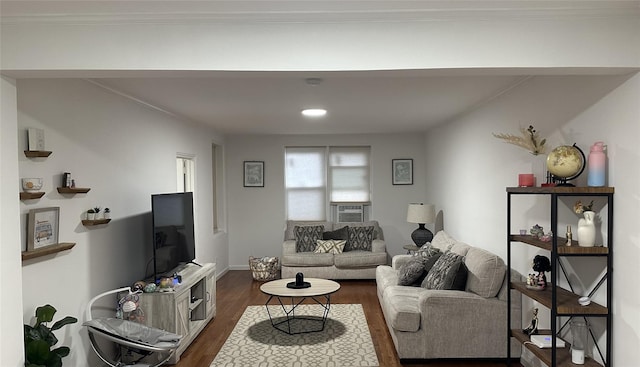 living room with crown molding, baseboards, dark wood finished floors, and cooling unit