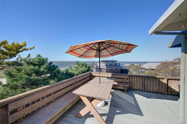 wooden terrace with a water view