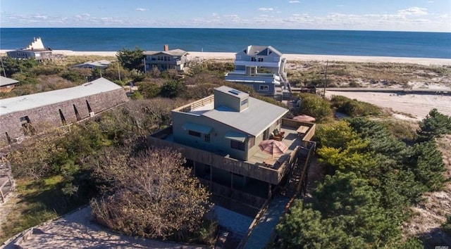 bird's eye view with a beach view and a water view