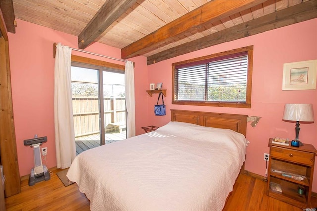 bedroom with access to exterior, beam ceiling, wood ceiling, and wood finished floors