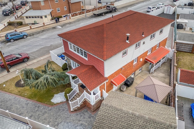 birds eye view of property with a residential view