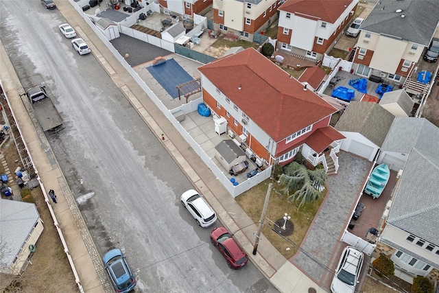 birds eye view of property with a residential view