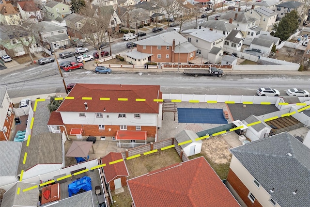 birds eye view of property with a residential view