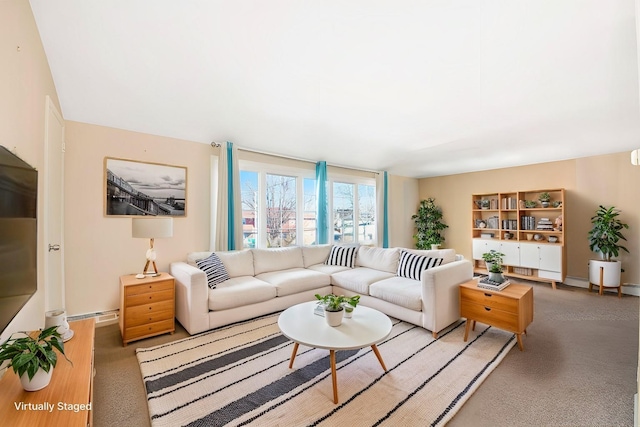 living area featuring baseboards