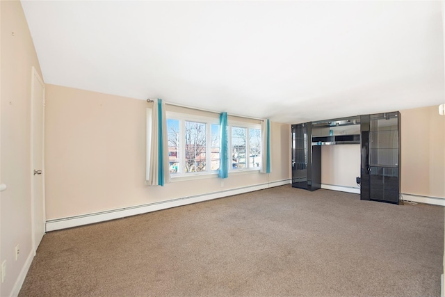 unfurnished living room featuring baseboard heating and carpet flooring