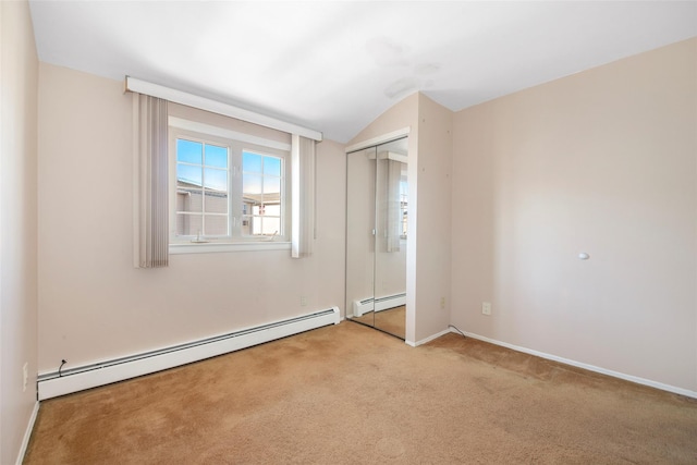 unfurnished bedroom with a closet, a baseboard radiator, carpet flooring, and baseboards