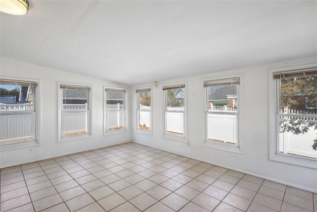 unfurnished sunroom with vaulted ceiling