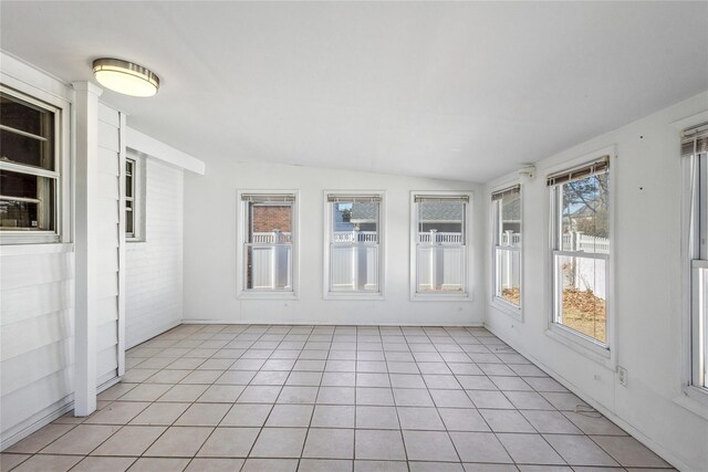 unfurnished sunroom with vaulted ceiling