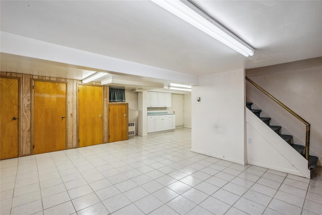 interior space with stairs and light tile patterned floors