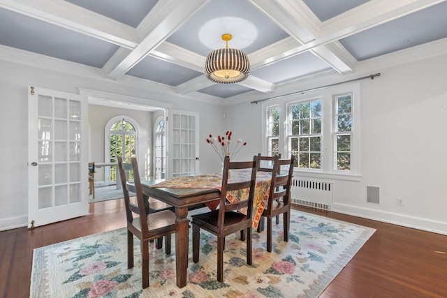 dining room featuring dark wood-type flooring, radiator, baseboards, and french doors