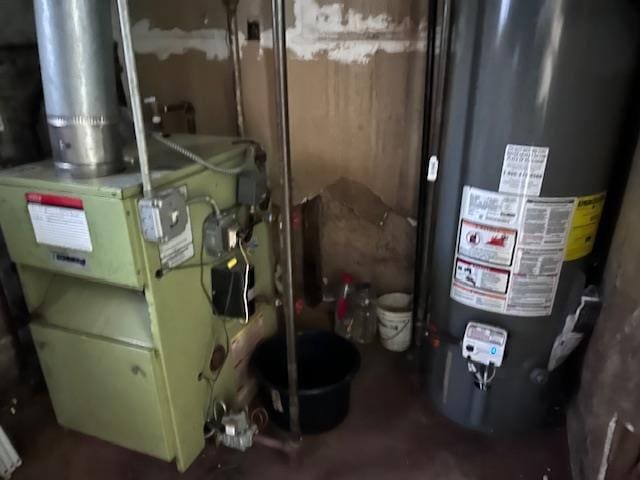 utility room featuring gas water heater