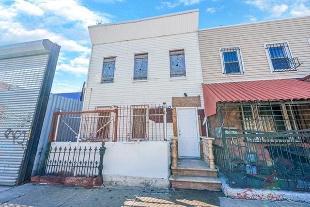 view of property with fence