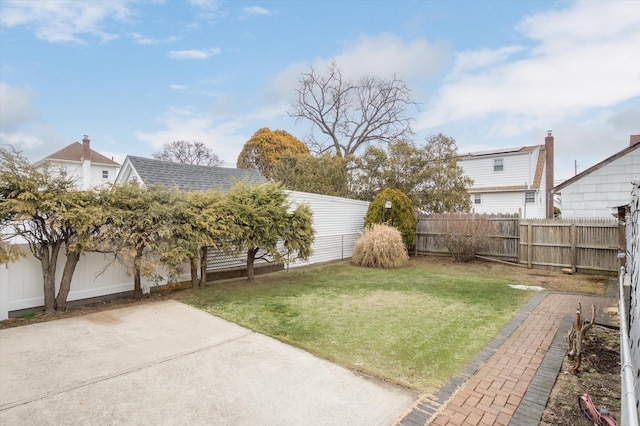 view of yard featuring a patio area and a fenced backyard