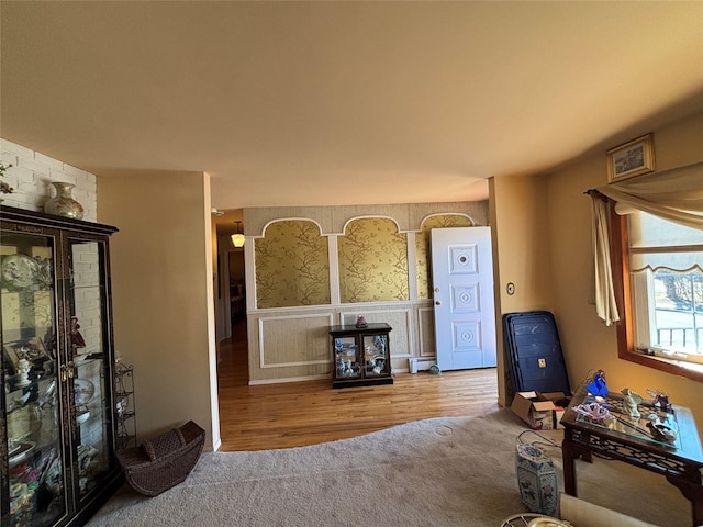 living room with carpet and a baseboard radiator