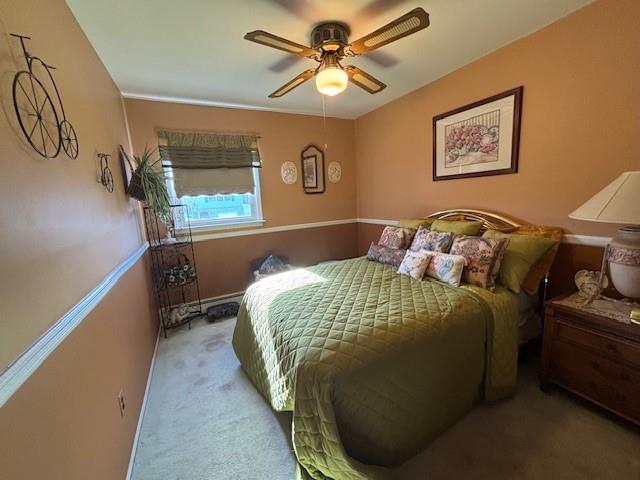 bedroom with carpet floors and a ceiling fan