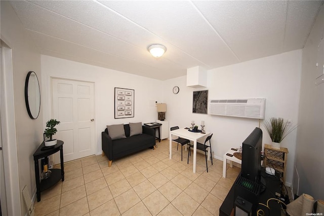 living room featuring light tile patterned floors and a wall mounted AC