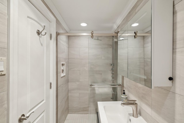 bathroom featuring a stall shower, vanity, and ornamental molding