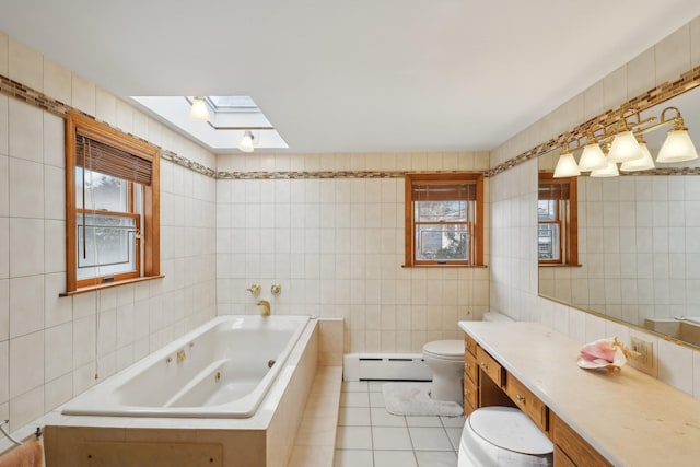 bathroom featuring tile patterned floors, a baseboard heating unit, a jetted tub, tile walls, and a skylight