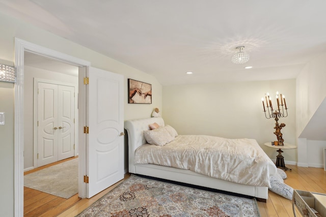 bedroom featuring recessed lighting, light wood-style floors, and baseboards