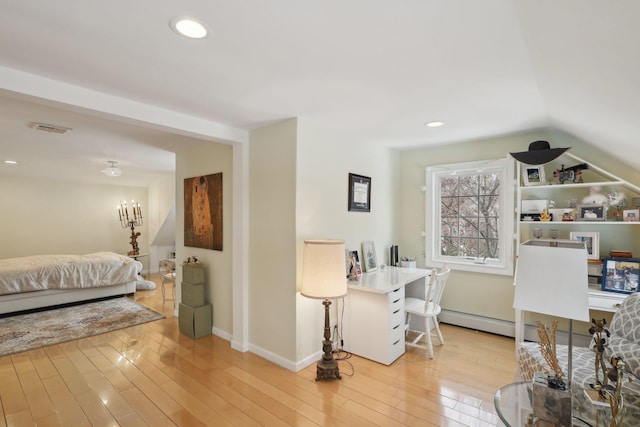 interior space with visible vents, baseboards, recessed lighting, light wood-style floors, and a baseboard heating unit