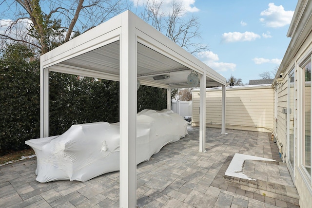 view of patio featuring fence