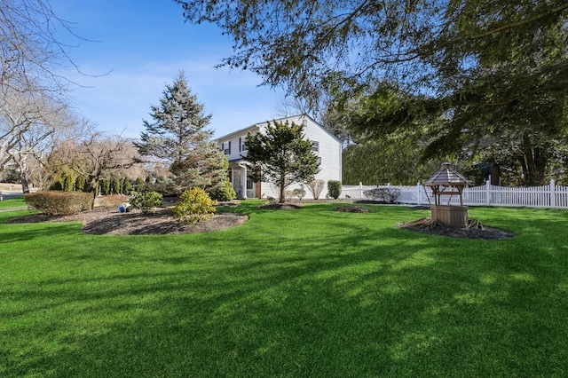 view of yard featuring fence and a gazebo