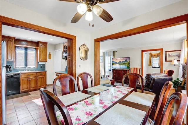 dining space with light tile patterned floors, ceiling fan, and a wealth of natural light