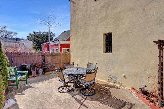 view of patio / terrace featuring outdoor dining space and fence