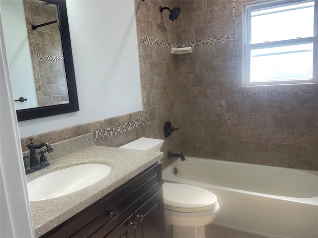 bathroom with toilet, bathing tub / shower combination, and vanity